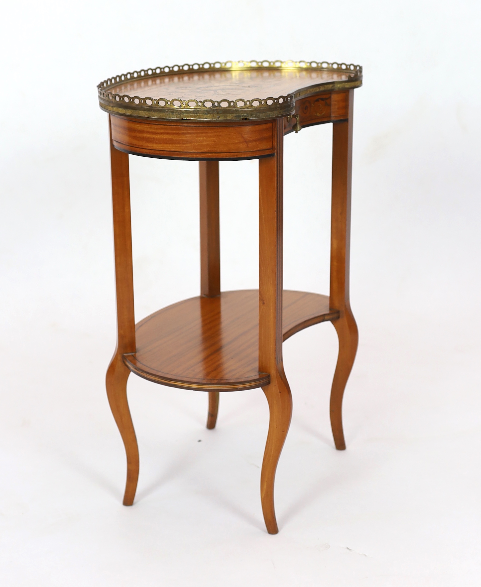 An Edwardian ormolu mounted satinwood kidney shape occasional table 53cm wide, 34cm deep, 65cm high